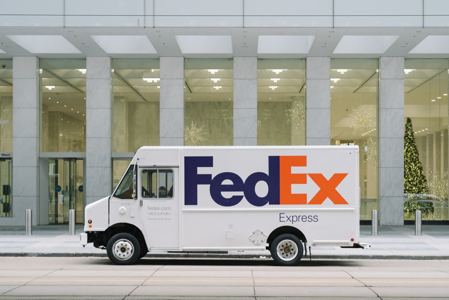 fedex truck in front of building